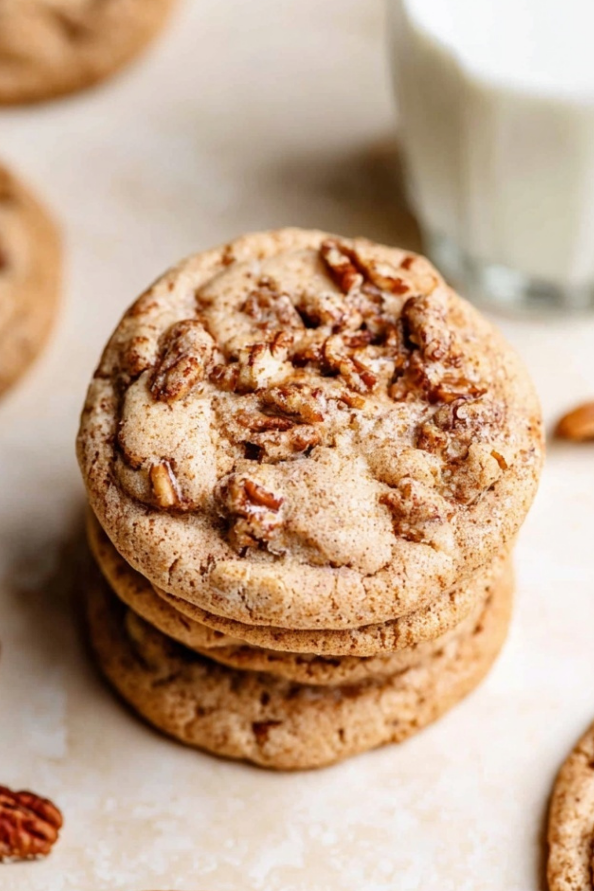 Freshly baked maple pecan cookies on a cooling rack