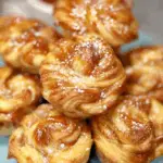 Peach Pie Cruffins with powdered sugar glaze and flaky layers