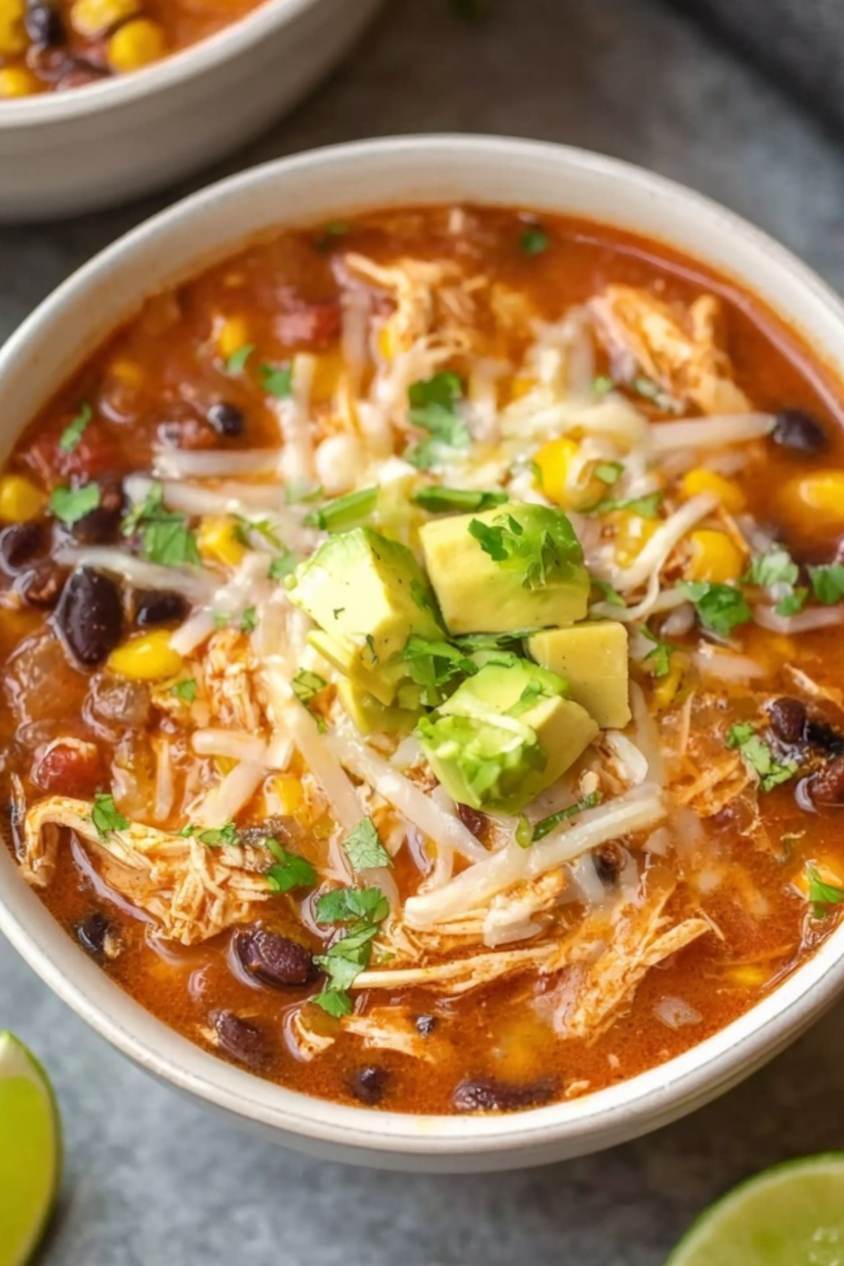 Taco Soup With Chicken in a bowl with toppings