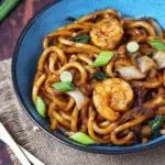 Yaki Udon with Shrimp served in a bowl with vegetables and sauce