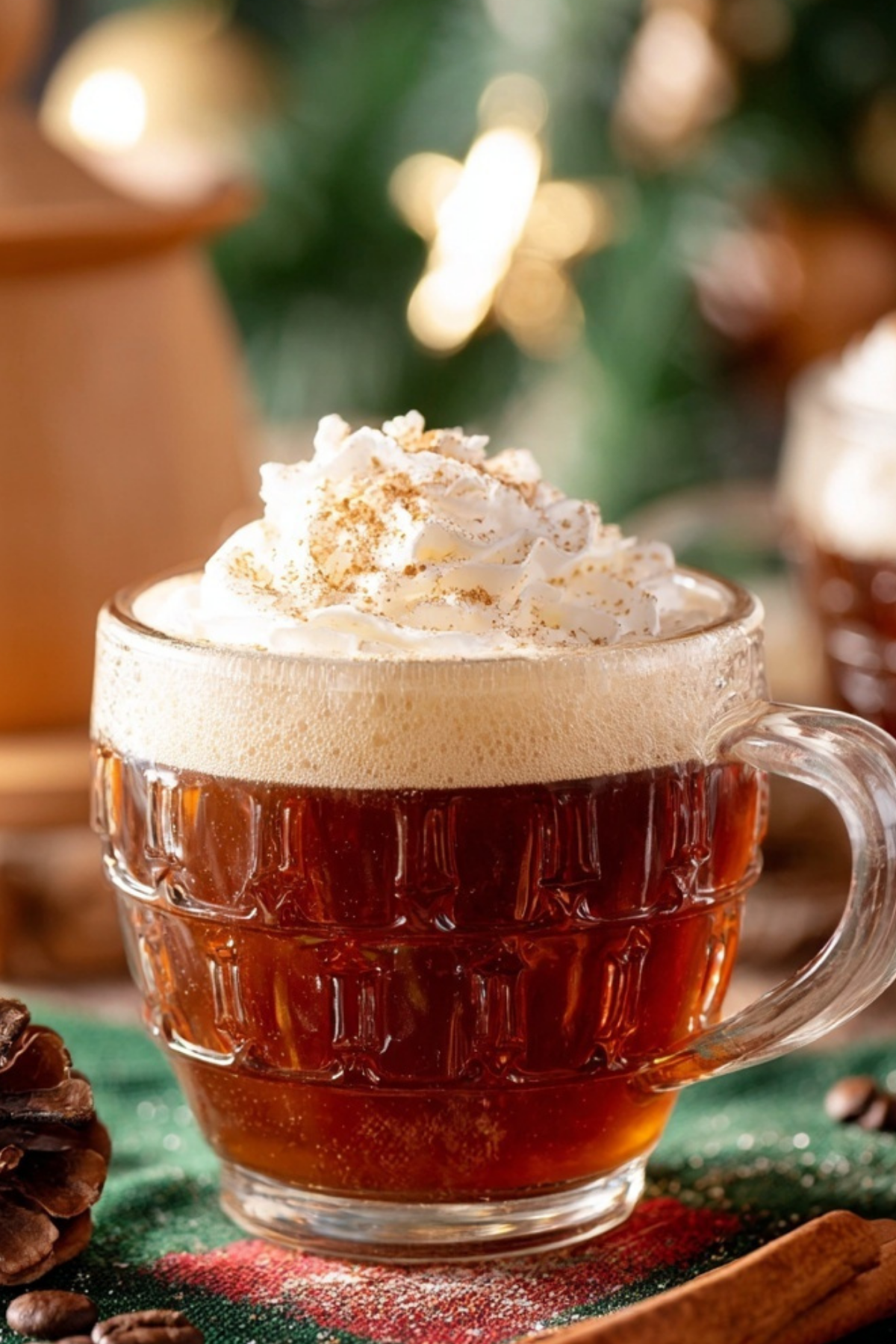 Christmas Coffee in a festive mug with whipped cream and cinnamon