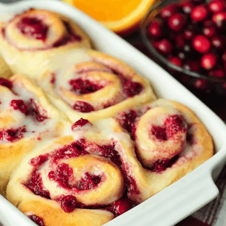 Cranberry Orange Sweet Rolls with glaze on top"