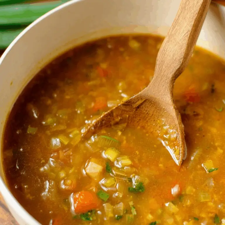 Hearty Vegetable Soup served in a bowl with fresh herbs