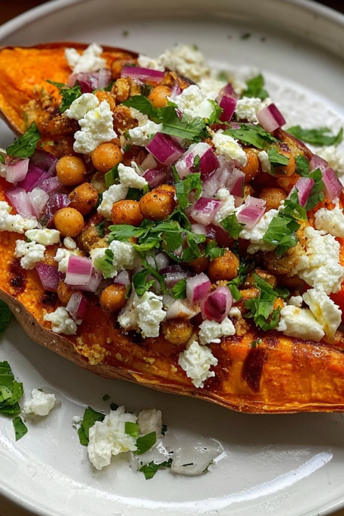 Loaded roasted sweet potato with hummus and roasted chickpeas