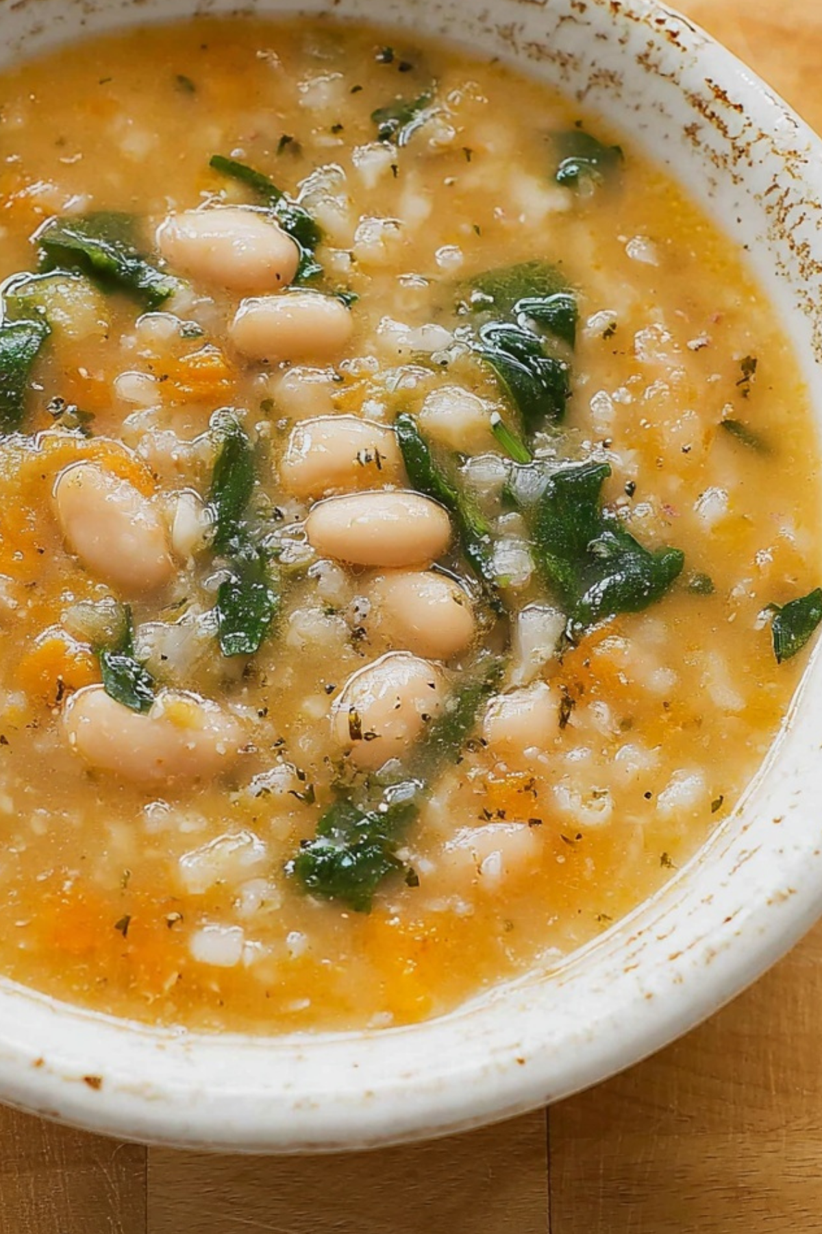 white bean soup in bowl with crusty bread