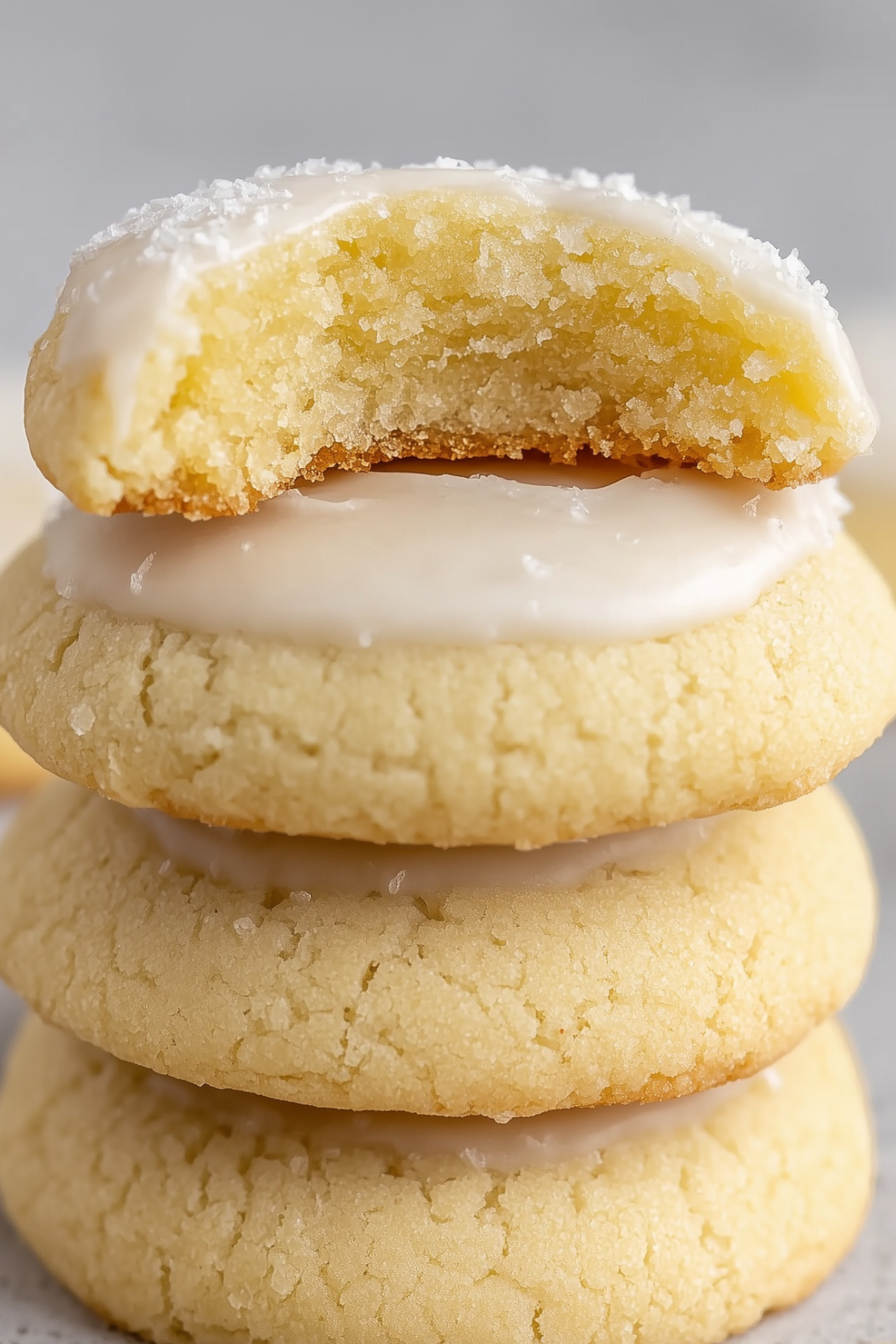 Almond Meltaway Cookies on cooling rack with almond glaze