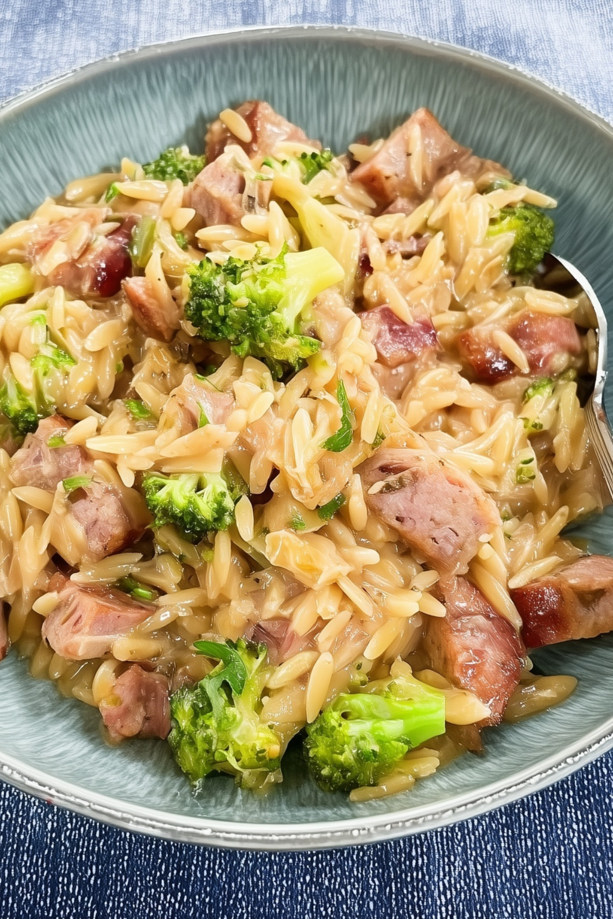 chicken sausage orzo skillet with broccoli in pan