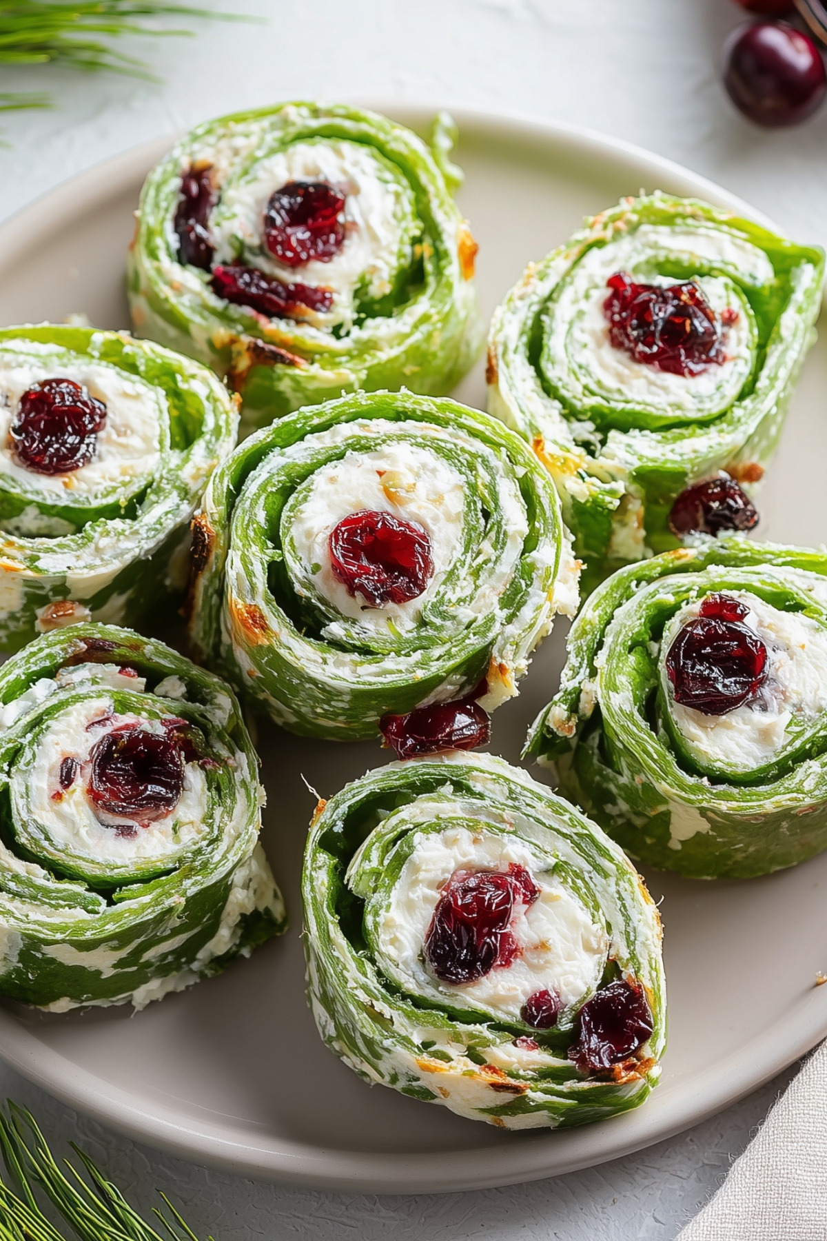 Christmas cranberry pinwheels appetizer on holiday serving platter