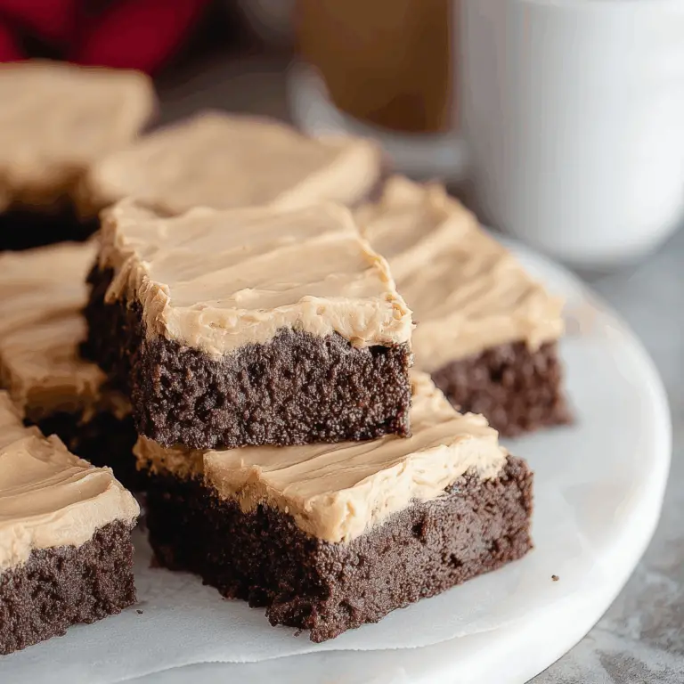 Frosted Coffee Brownies topped with creamy coffee frosting