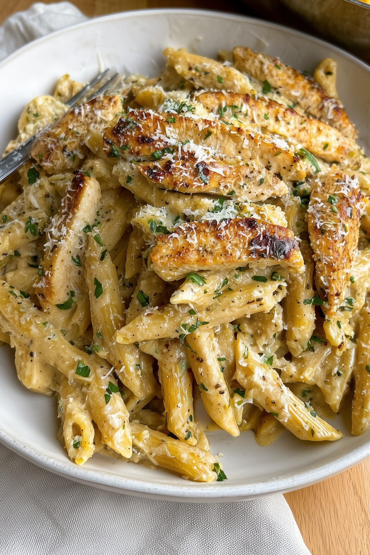 Garlic Parmesan Chicken Pasta served in a creamy sauce with chicken and pasta
