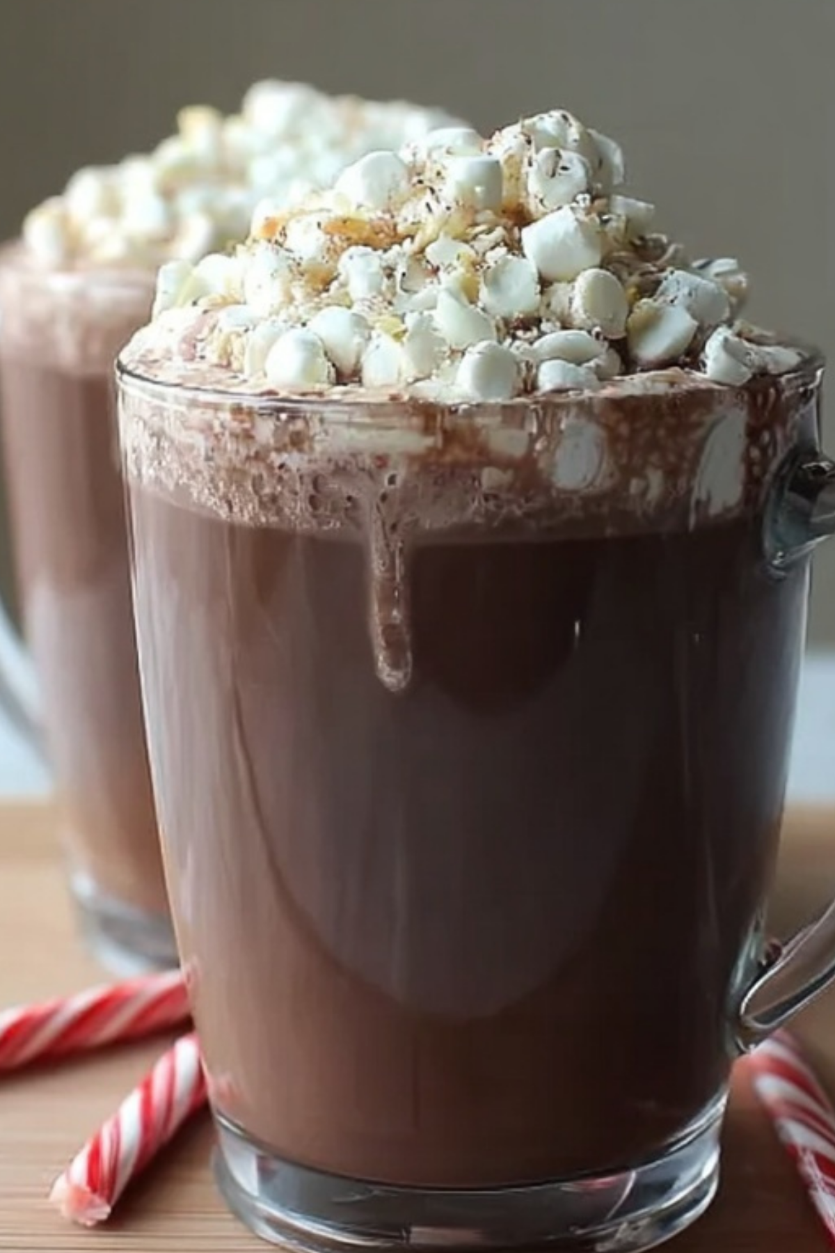 Mug of creamy hazelnut hot chocolate with whipped cream and chocolate shavings
