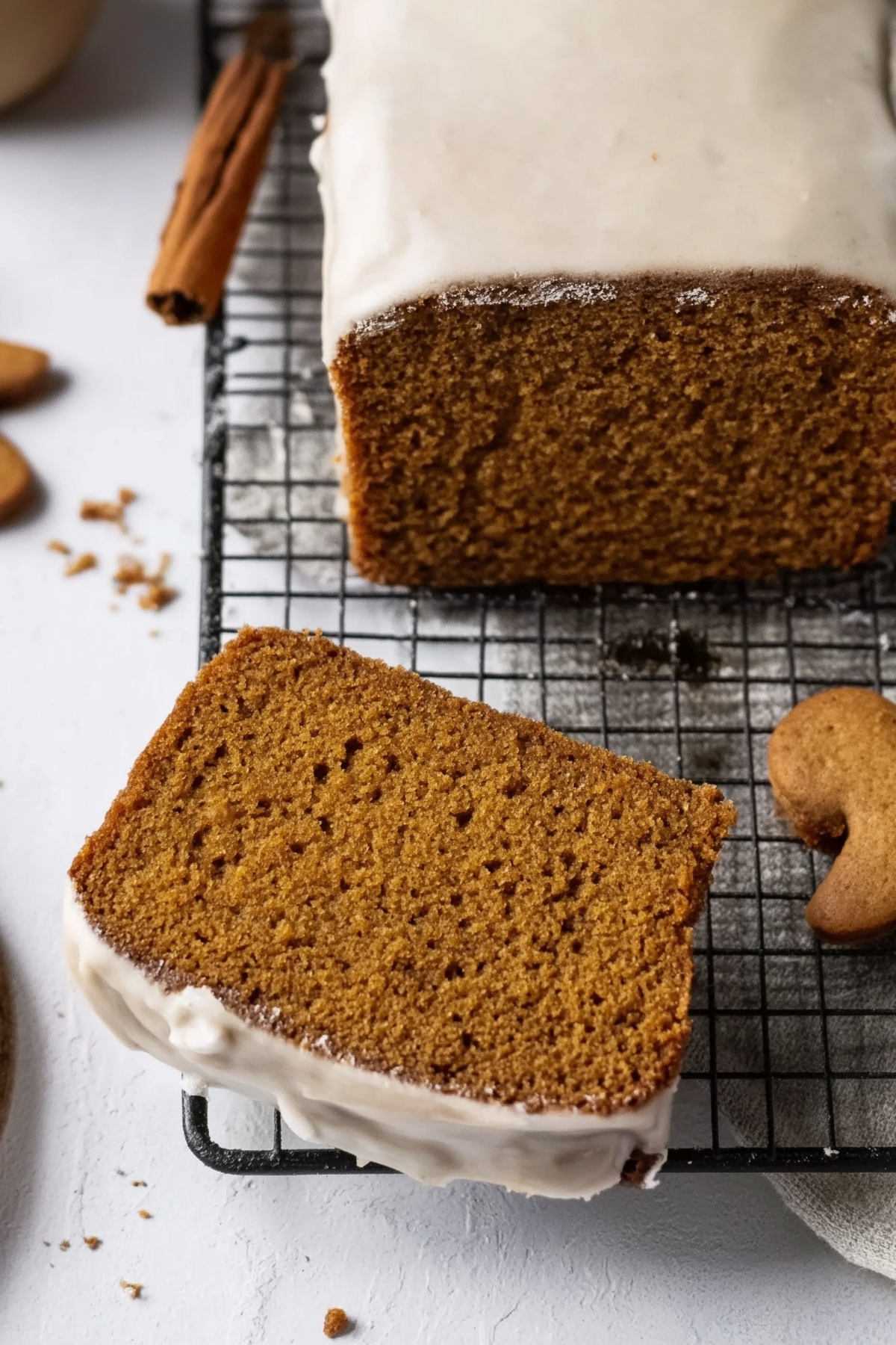Iced gingerbread loaf cake with vanilla glaze on top
