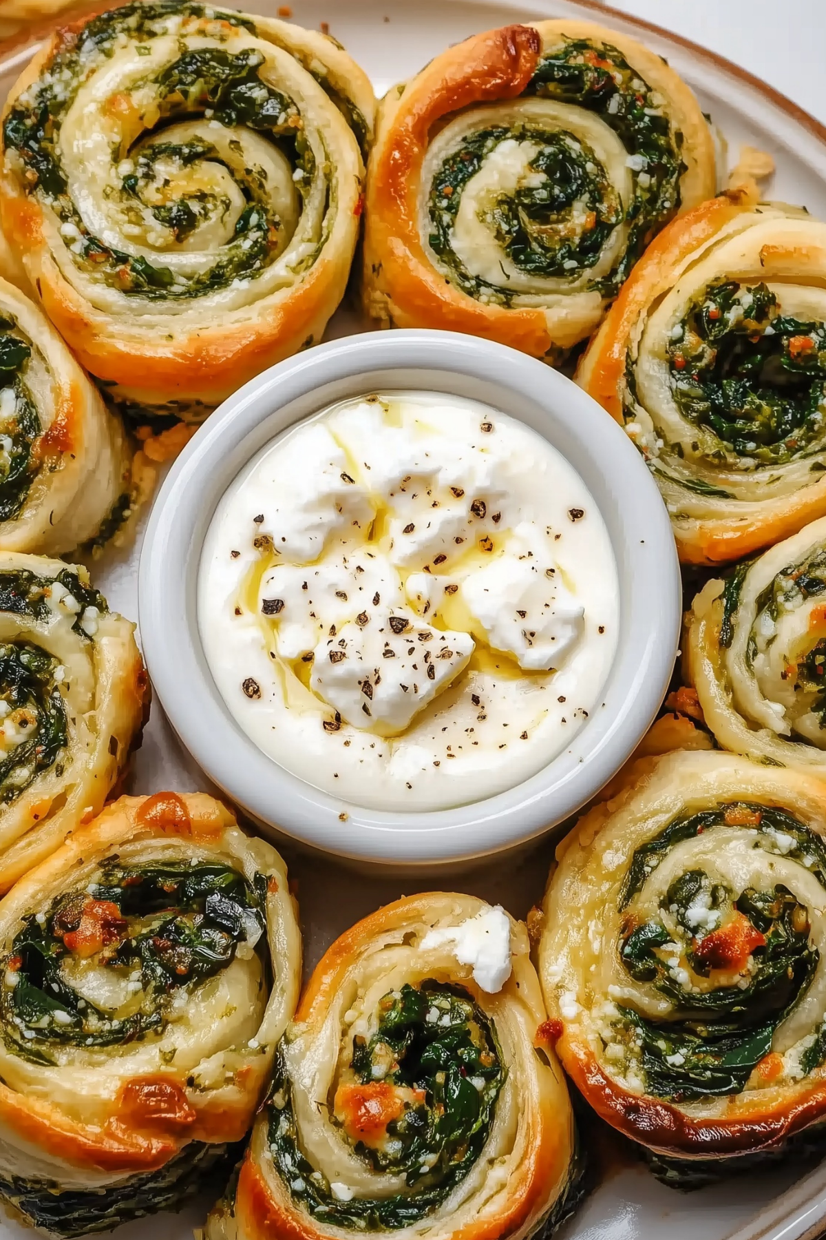 Golden Spinach and Feta Pinwheels served with yogurt dip