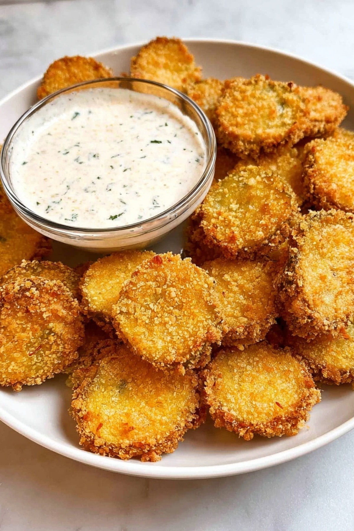 Air Fryer Fried Pickles served with creamy dipping sauce