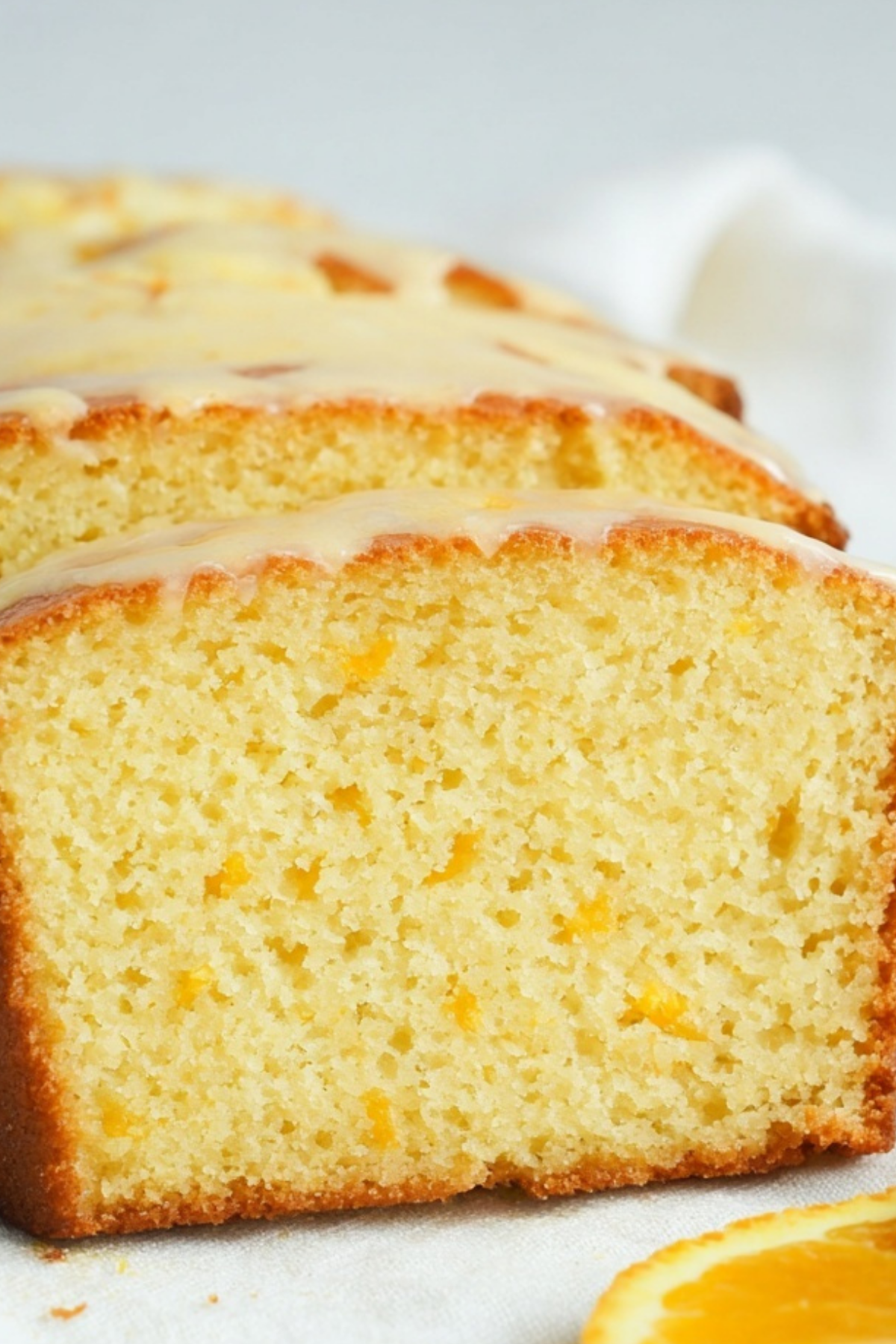moist orange loaf cake with glaze on top
