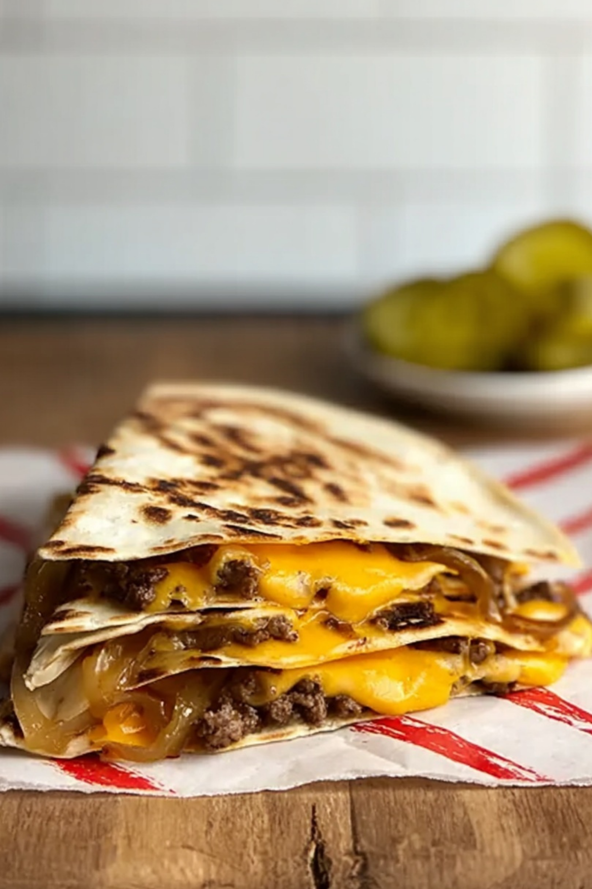 Smash Burger Quesadilla on plate with melted cheese and crispy tortilla