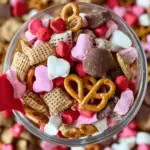 Valentine Sweet and Salty Snack Mix in a festive bowl with pink and red M&Ms