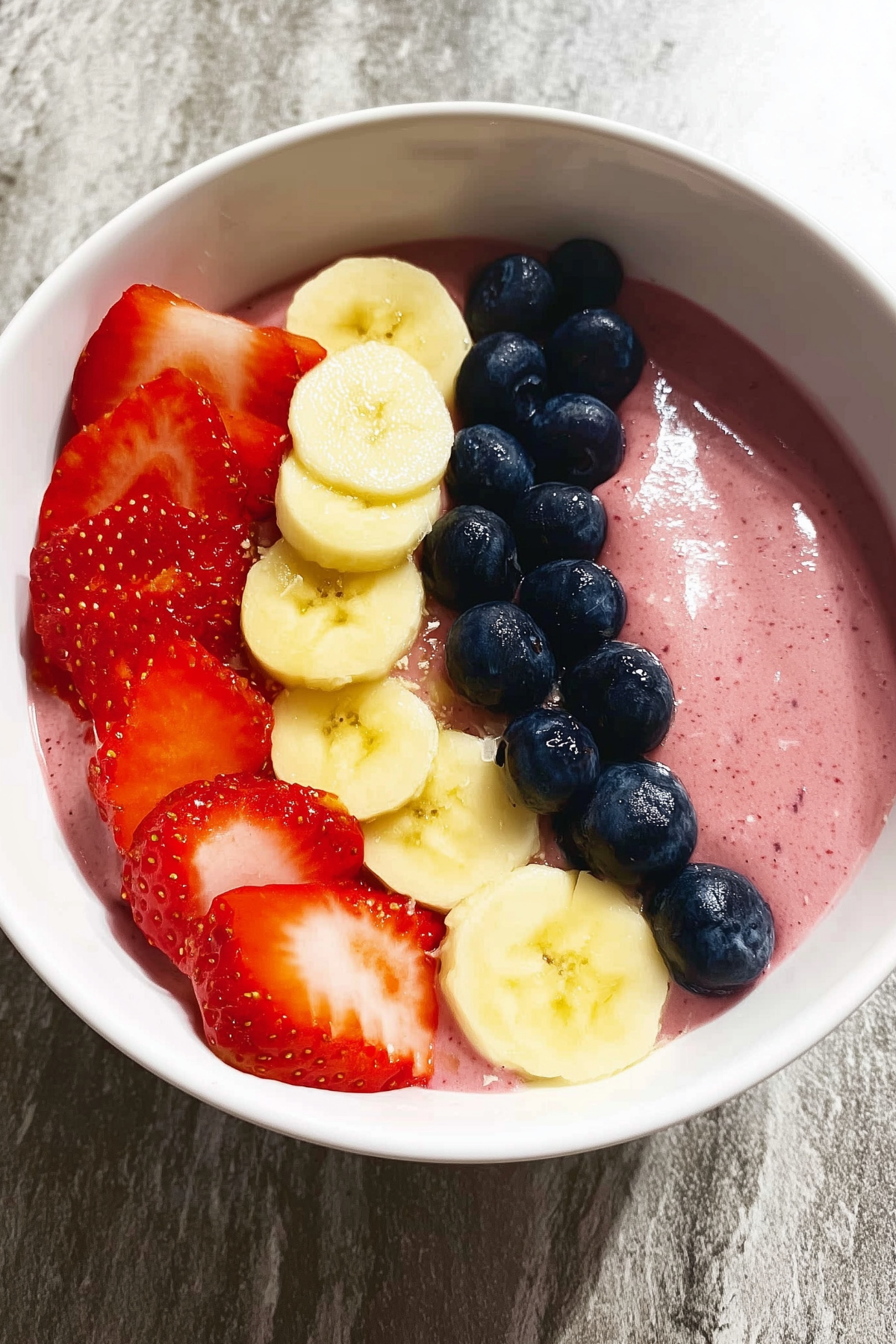 Fruit Smoothie Bowl topped with fresh fruit, granola, and seeds
