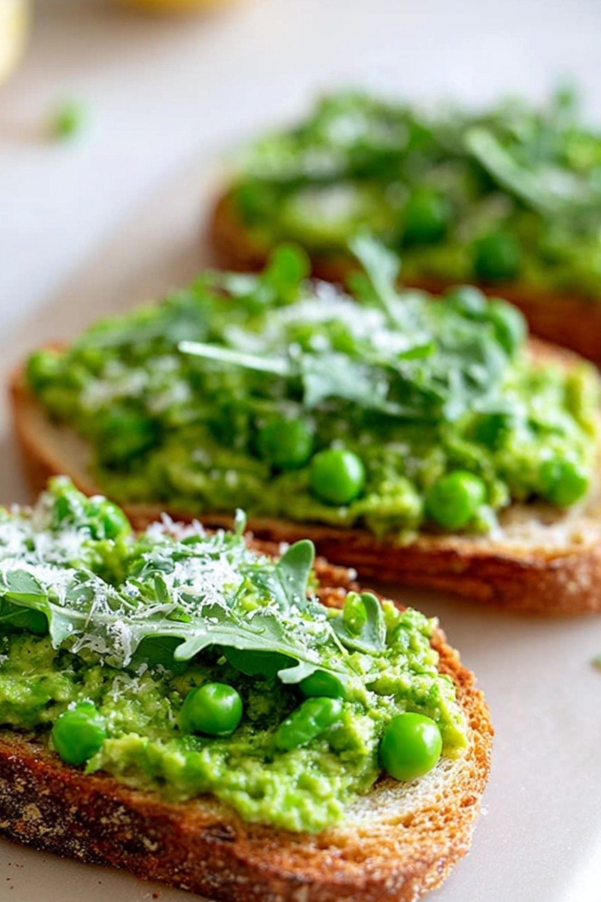 Pea Bruschetta on ciabatta with parmesan and lemon zest