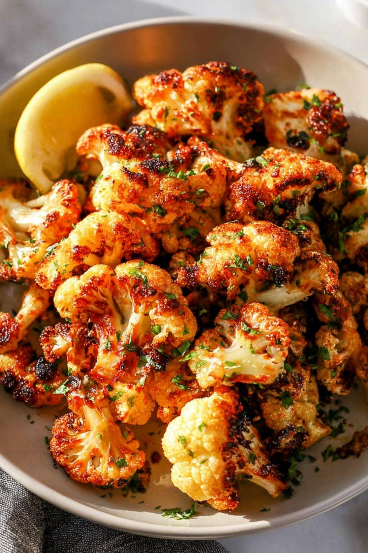 golden crispy parmesan roasted cauliflower on baking sheet