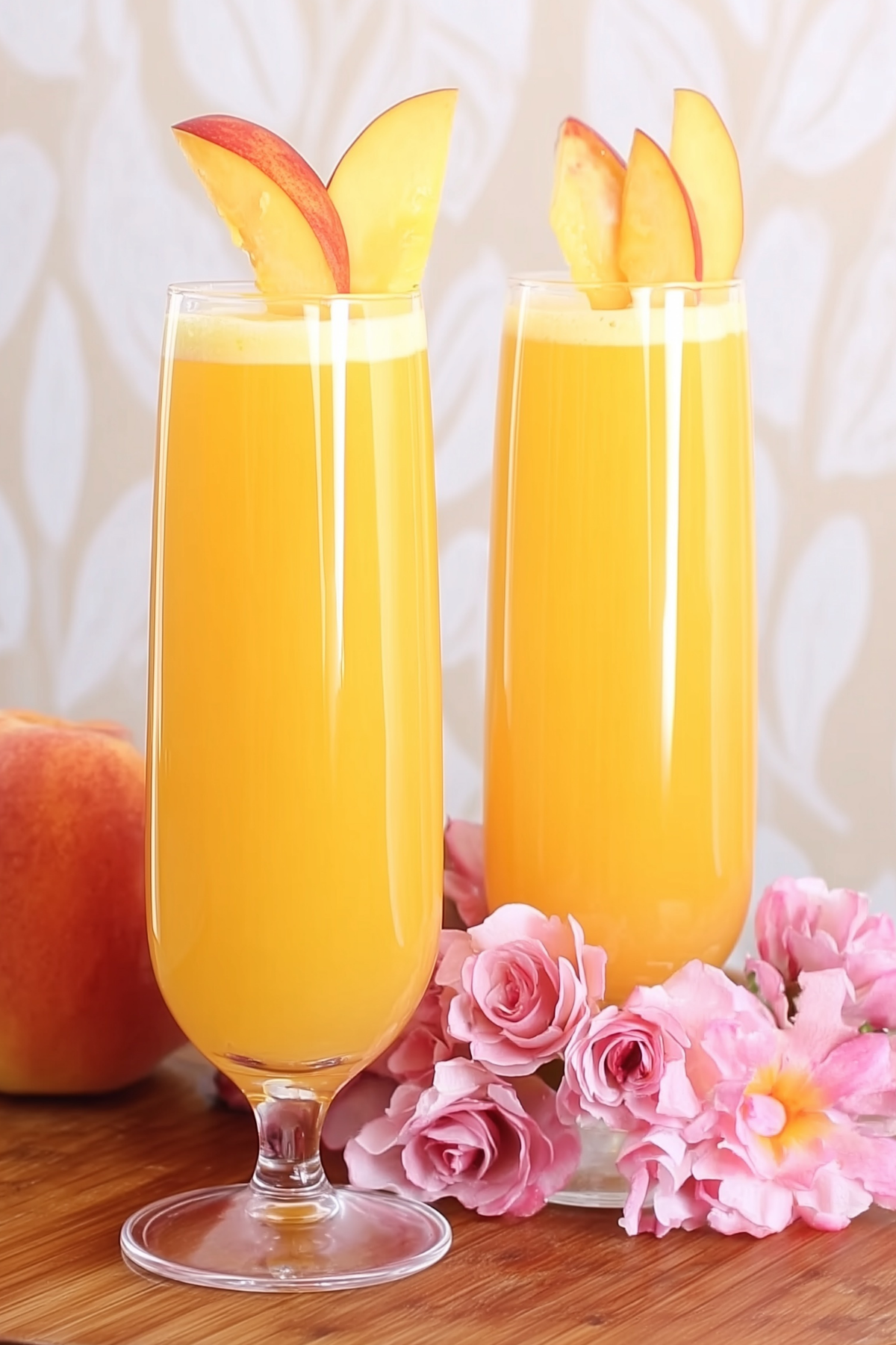 Peach Bellini Mocktail served in a glass with fresh peach garnish