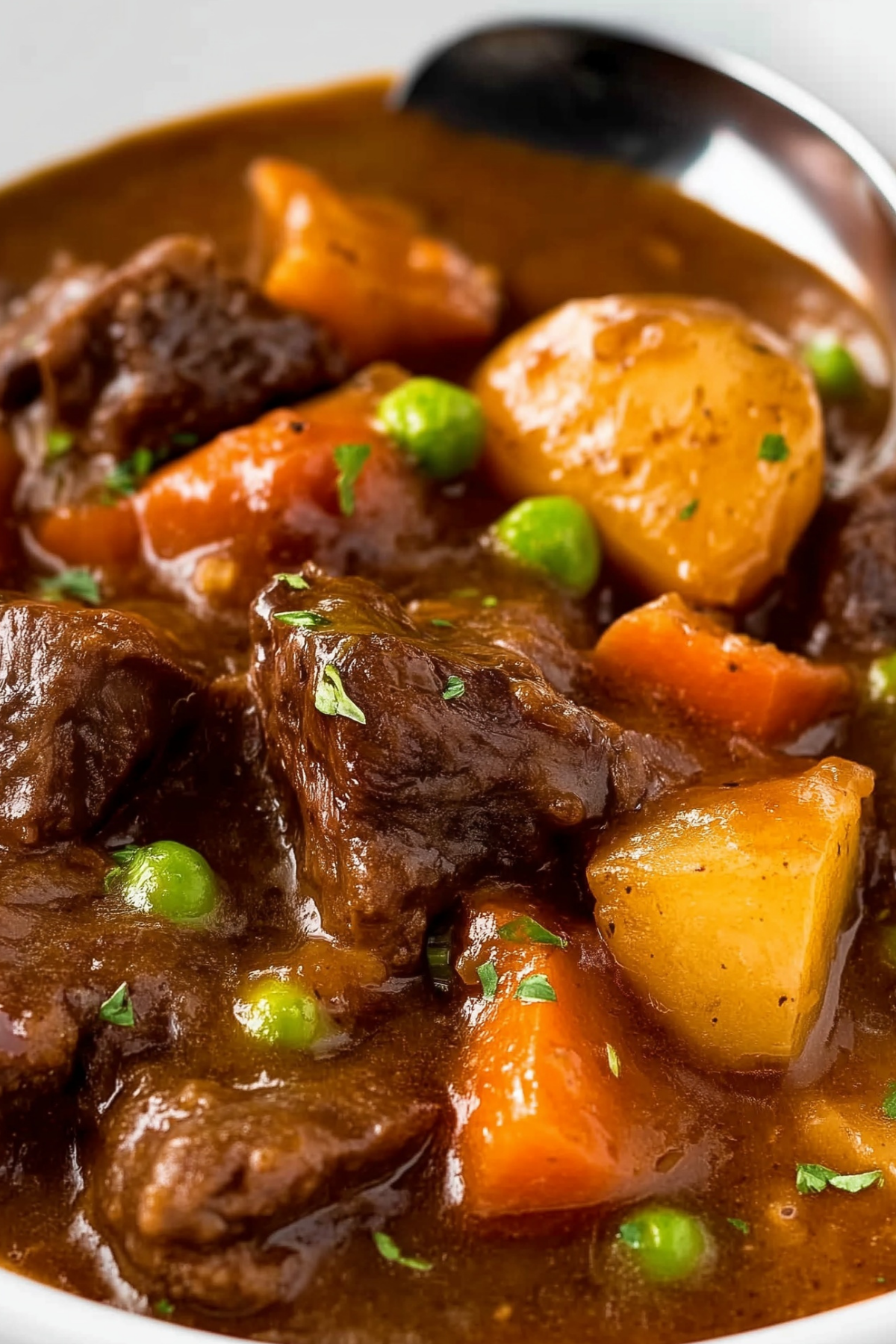 Slow Cooker Beef Stew with tender beef, carrots, and potatoes in rich gravy