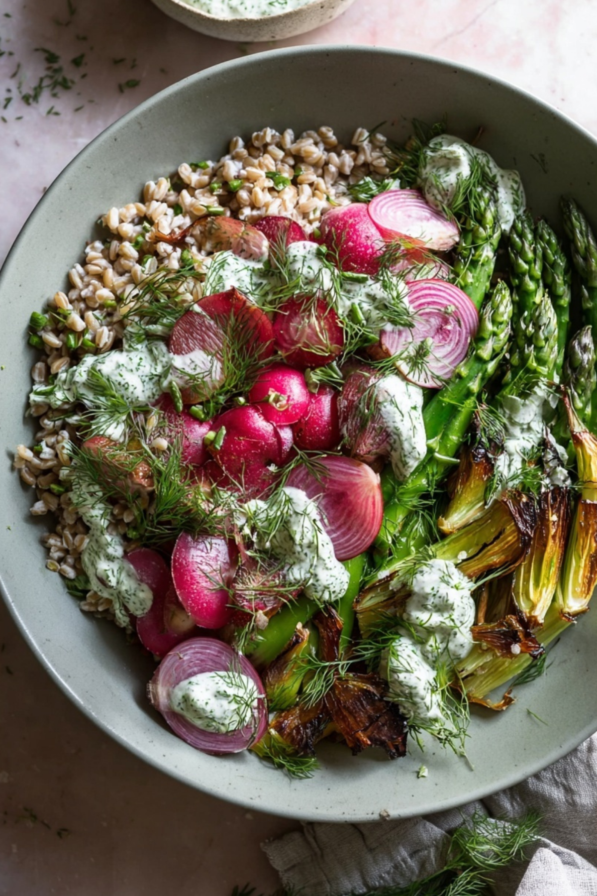 Spring Farro Bowl with Herb Yogurt Sauce with roasted vegetables