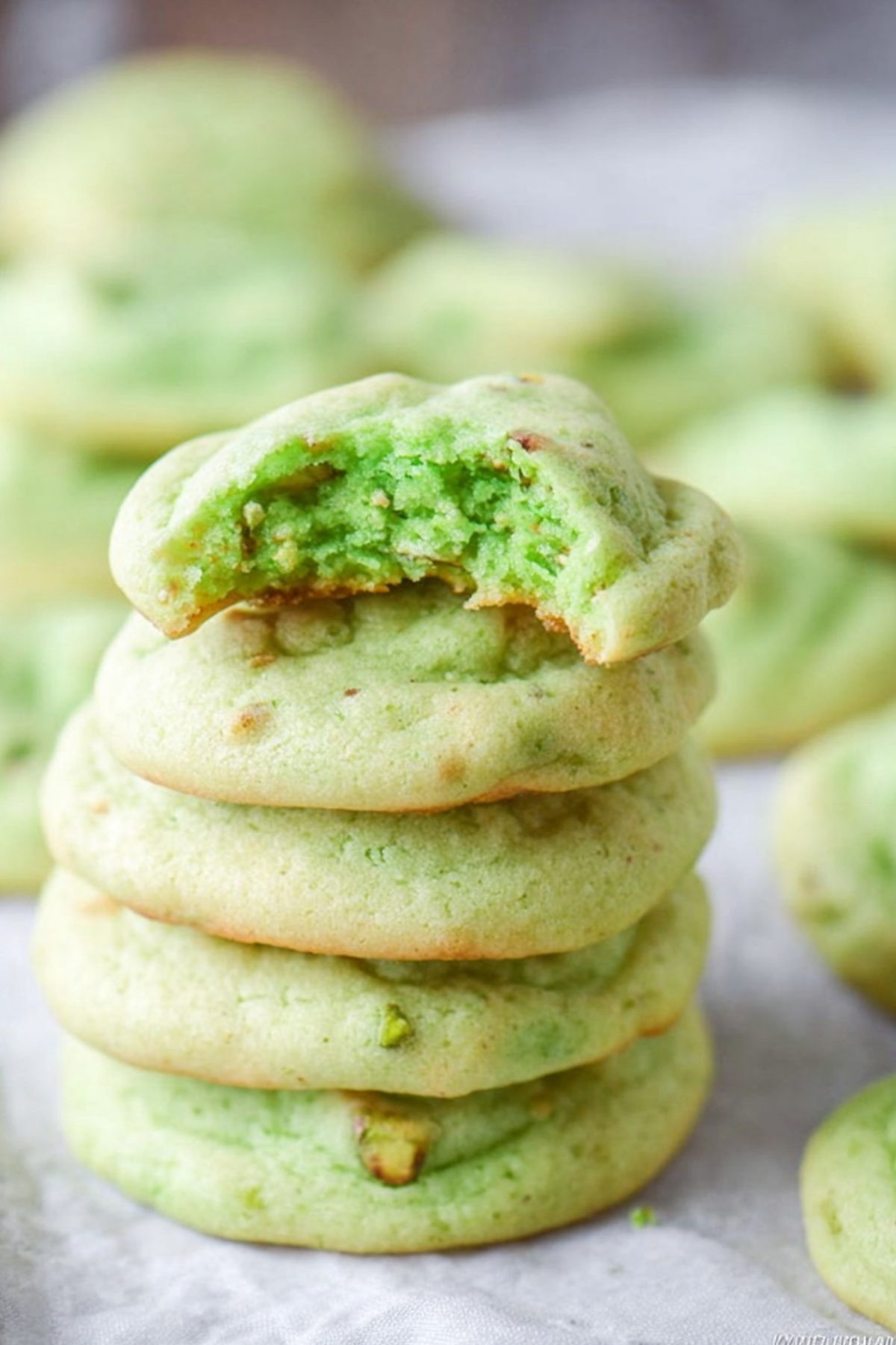 Soft and chewy Pistachio Pudding Cookies on a cooling rack