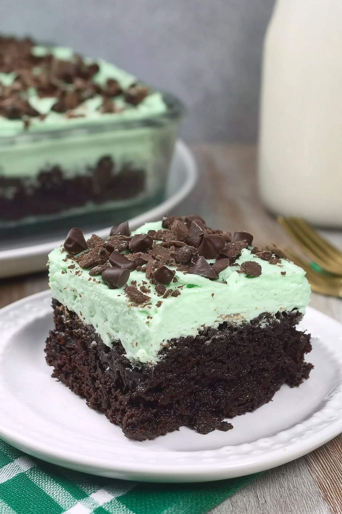 Andes Mint Poke Cake with chocolate, mint, and whipped cream