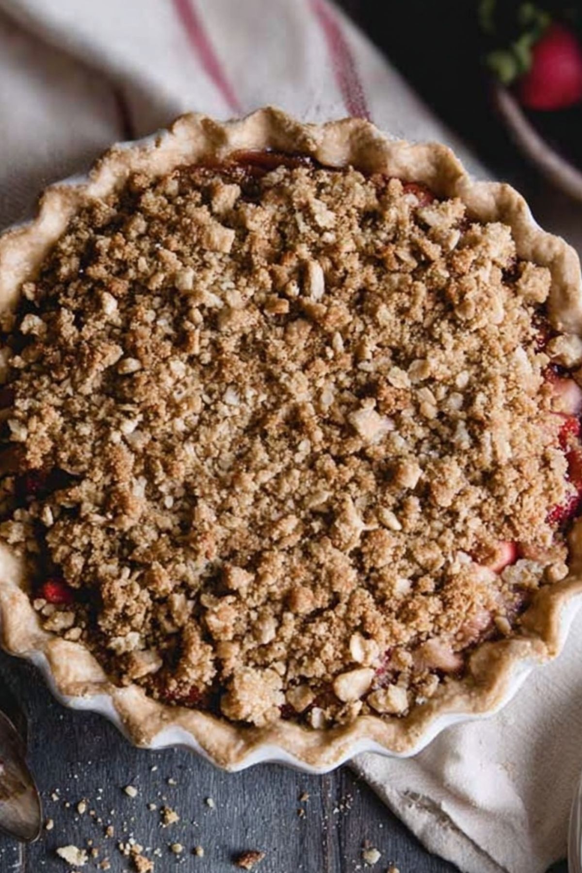 Strawberry Rhubarb Pie with Crumb Topping served on a plate