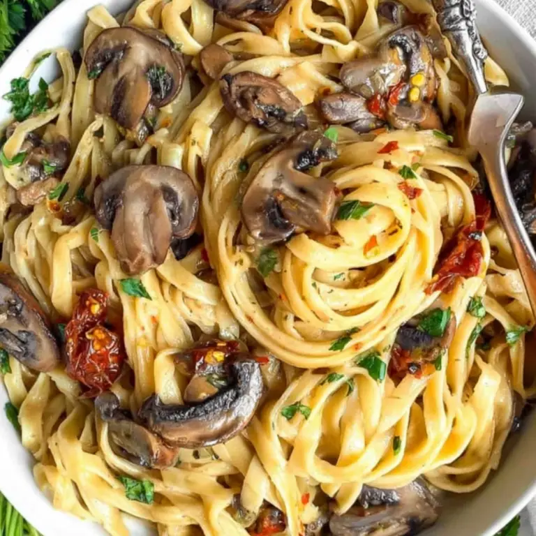 Creamy vegan mushroom pasta with cherry tomatoes and parsley