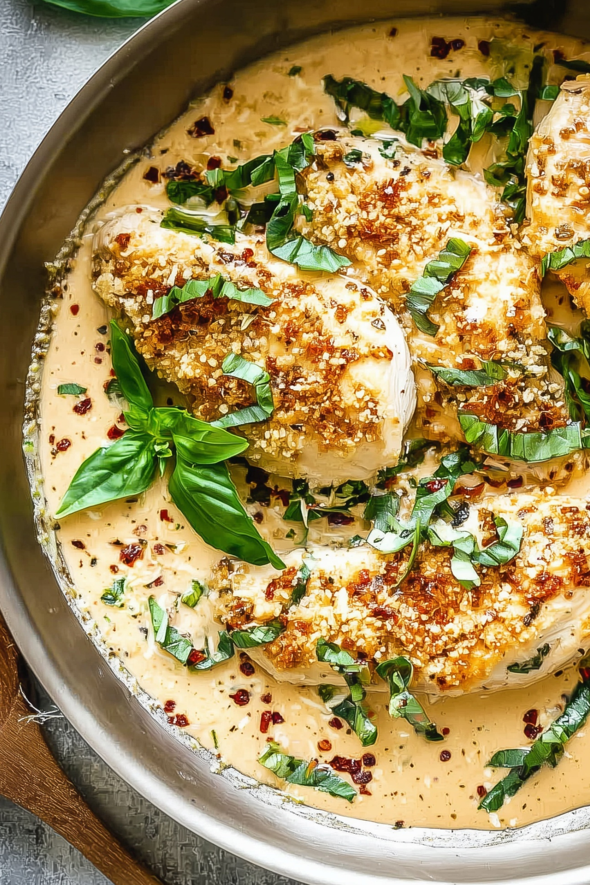 Creamy Parmesan Basil Chicken with fresh basil and roasted peppers