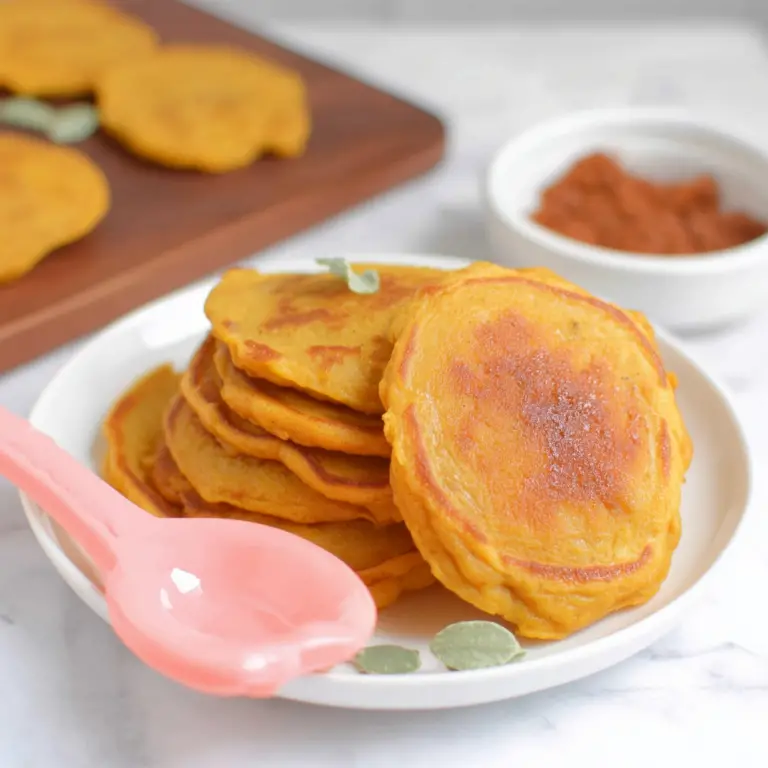 Delicious pumpkin pancakes stacked with syrup and fruits