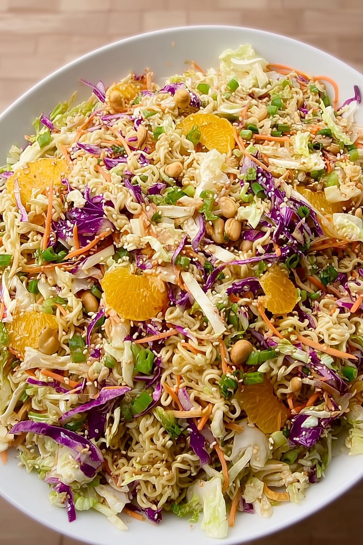 Bowl of fresh ramen noodle salad with vegetables and dressing