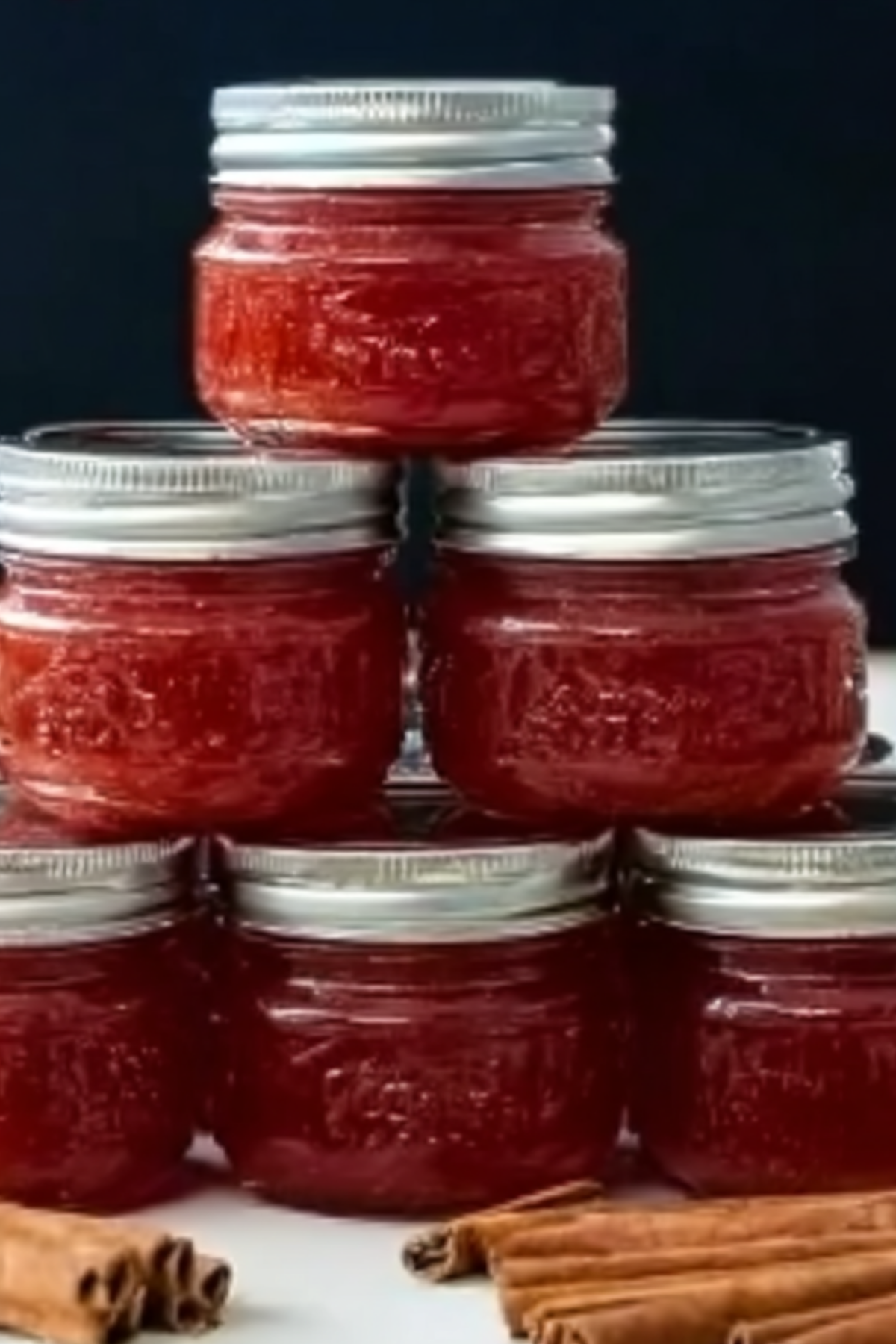Rhubarb Cinnamon Jam in a jar with fresh rhubarb and cinnamon