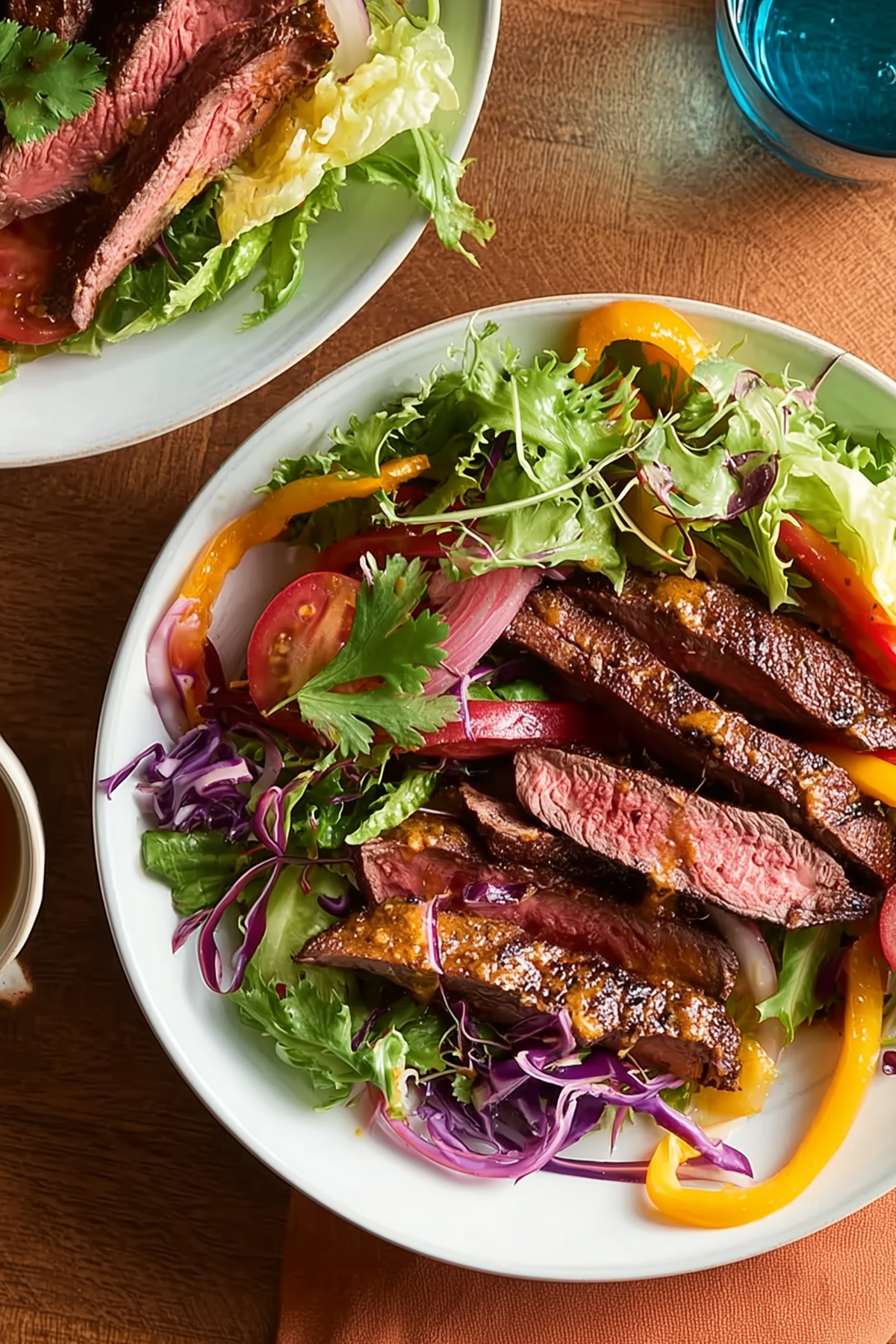 warm fajita steak salad with grilled steak and fresh vegetables